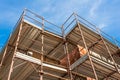 House for renovation with the scaffolding for bricklayers Royalty Free Stock Photo