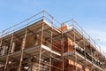 House for renovation with the scaffolding for bricklayers Royalty Free Stock Photo