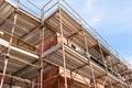 House for renovation with the scaffolding for bricklayers Royalty Free Stock Photo