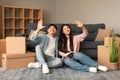 Cheerful Asian Couple Planning Renovation In New Apartment After Moving Royalty Free Stock Photo