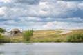 House and the road that runs next to the lake. Rural landscape Royalty Free Stock Photo