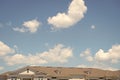 House roof on blue sunny sky background. Architecture and structure. design concept. rent an apartment. relocation