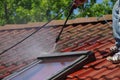 House roof cleaning with pressure tool Royalty Free Stock Photo