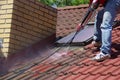 House roof cleaning with pressure tool Royalty Free Stock Photo