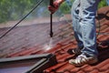 House roof cleaning with pressure tool Royalty Free Stock Photo