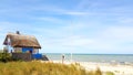 House with Roof ree or thatch on the beach Royalty Free Stock Photo