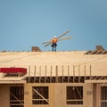 House roof. Roofing construction. Roofer using air nail. Roofing tiles of the new roof under construction building