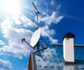 House Roof with Solar Panels and Antennas Royalty Free Stock Photo