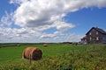 House and round hay bails Royalty Free Stock Photo