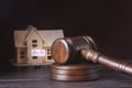 House for sale, auction hammer , symbol of authority and Miniature house . Courtroom concept. Royalty Free Stock Photo