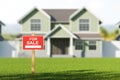 House for sale, red sign in front of blurred modern big building on grass Royalty Free Stock Photo