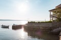 Boat on the pier near a large house with a terrace Royalty Free Stock Photo