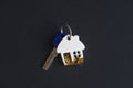 House shaped keychain with a key Royalty Free Stock Photo