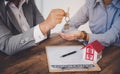 House signers signing signature loan document to home ownership with real estate agents ownership. Mortgage and real estate Royalty Free Stock Photo