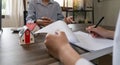 House signers signing signature loan document to home ownership with real estate agents ownership. Mortgage and real Royalty Free Stock Photo