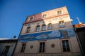 House At The Silver Denarii  Narrow picturesque street with baroque and renaissance historical buildings in winter sunny day in Royalty Free Stock Photo