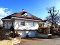 House for single family in white with special cross roof and dormer