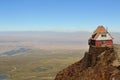 House sitting high on the edge of rocky cliffs