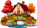 A house is situated on a hill in a stunning autumn landscape, featuring a stream and a river in the foreground Royalty Free Stock Photo
