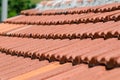 House with sloping pitched roof, self-supporting red tiles.