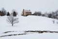 House on a snow covered hill, in a rural area of Carroll County, Maryland.