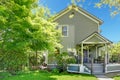 House spring grey exterior with entrance porch.