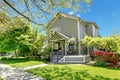 House spring grey exterior with entrance porch.