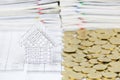 House with stack of gold coins on another side Royalty Free Stock Photo