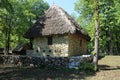 House with straw roof in Dimitrie Gusti National Village Museum in Bucharest Royalty Free Stock Photo