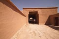 House in tinghir, traditional house of clay and straw. Earth house with blue steel doors. One door open. Royalty Free Stock Photo