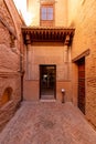 House in tinghir, traditional house of clay and straw. Earth house with blue steel doors. One door open. Royalty Free Stock Photo