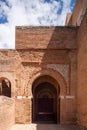 House in tinghir, traditional house of clay and straw. Earth house with blue steel doors. One door open. Royalty Free Stock Photo