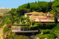 House on a Top of a Cliff, Lush Front Garden, Europe Holidays Royalty Free Stock Photo
