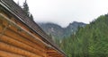 A house for tourists on the background of the foggy Tatra Mountains.