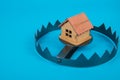 A house in trap. Concept risk in real estate. Royalty Free Stock Photo