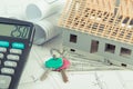 House under construction, keys, calculator and currencies dollar on electrical drawings and diagrams Royalty Free Stock Photo