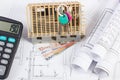 House under construction, keys, calculator, currencies euro and electrical drawings, concept of building home Royalty Free Stock Photo