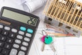 House under construction, keys, calculator and currencies euro on electrical drawings and diagrams Royalty Free Stock Photo