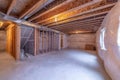 House under construction with wood beams and air conditioning ducts on ceiling