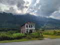 House under the hill near the main road Royalty Free Stock Photo