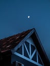 House under the moon right after sunset