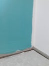 House under renovation: turquise wall wet paint