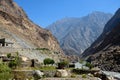 House in valley by riverside and hanging laundry amidst mountains Skardu Pakistan Royalty Free Stock Photo