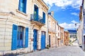 House with vibrant blue doors, windows and shutters