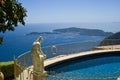 House villa with statue over pool view