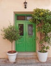 house vivid green door and flowerpots at Plaka neighborhood, Athens Greece Royalty Free Stock Photo