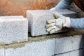 House wall construction - mason laying expanded clay blocks