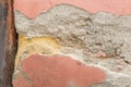 House wall with flaking plaster