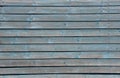 House wall with shabby light blue planks, texture