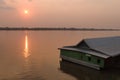 House on water of the Mekong river on sunset Royalty Free Stock Photo